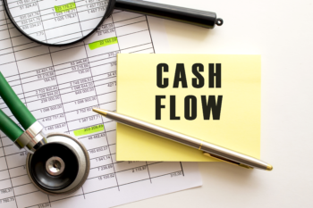 Cash flow written on yellow paper