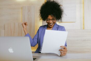 Woman smiling after finding the business accounting services her startup needs