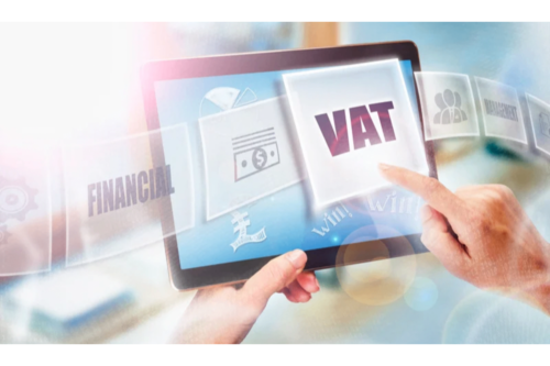 Person using tablet with VAT and financial icons