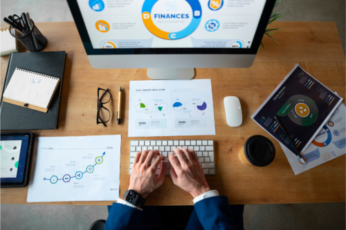 Person in the office analyzing and checking finance graphs