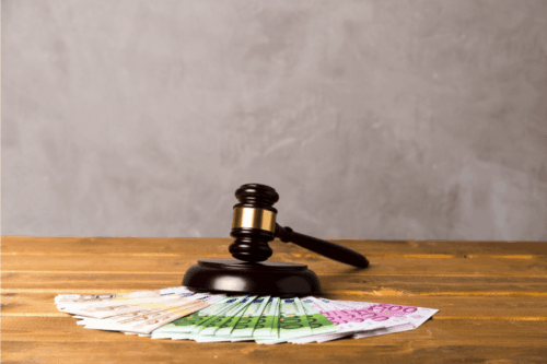 A gavel near cash