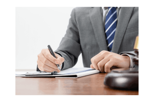 A man checking accounts with a gavel nearby