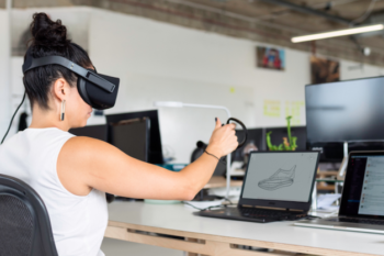 Virtual reality employee creating picture on screen